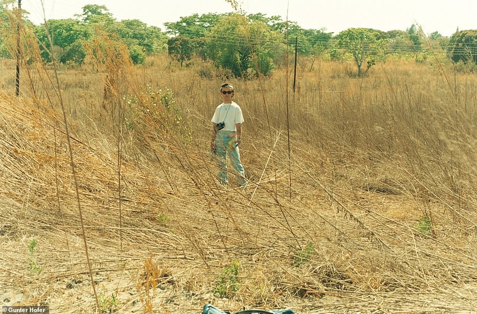 Gunter Hofer beside flattened grass