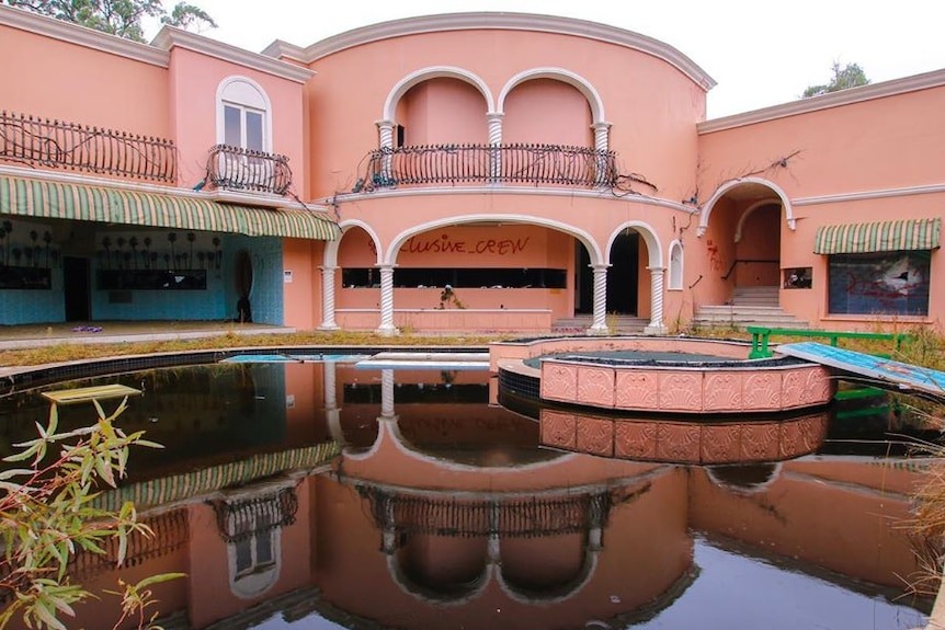 The derelict Big Brother house and its stagnant pool, 2019
