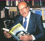 The late psychical researcher Maurice Grosse reading Guy Playfair's book