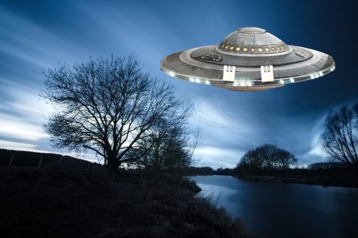Illustrative composite of a UFO over a river