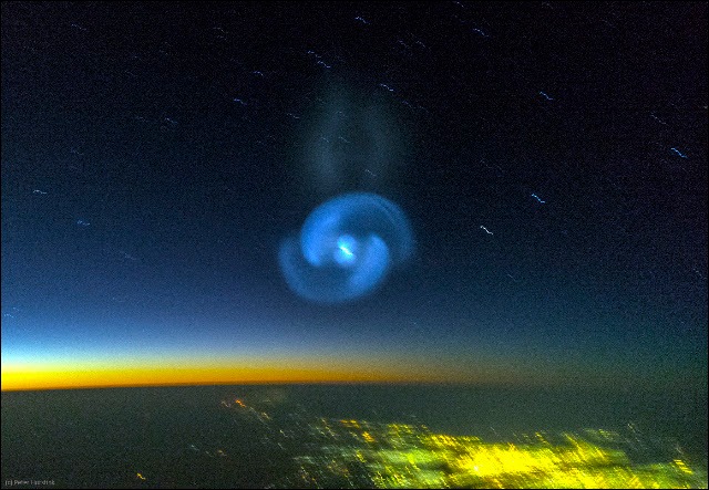 The green spiral against the stars, photographed from the cockpit of Martinair flight MPH8371