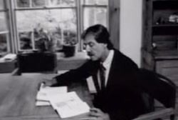 Witness Dennis Sant with books