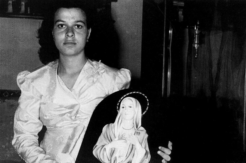 Antonina Giusto holding the plaque, 1 September 1953.